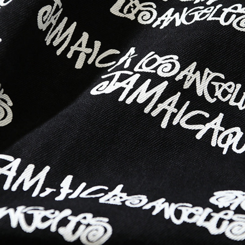 American-style baseball jacket Stu x Tears American High-Street Collaboration: Denim Jacket Featuring All-Over Barrage Text Print and Embroidered Cotton Boll Motifs.